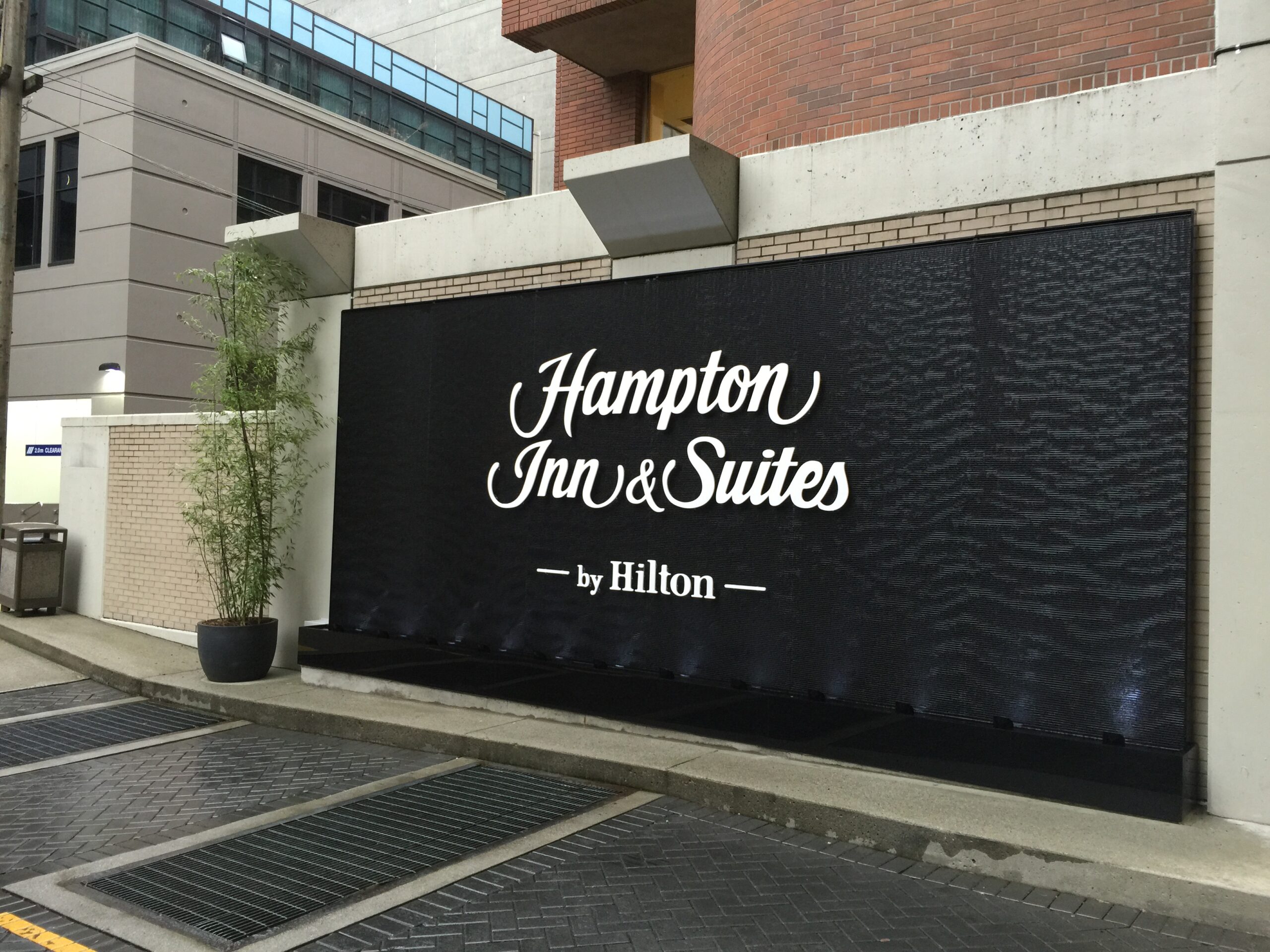 Black Scored Acrylic Water Wall Aquafall with Logo for Hampton Inn Vancouver Canada 2 scaled