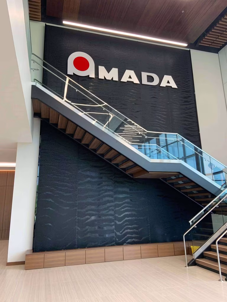Black Scored Acrylic Water Wall at Amada Offices in High Point, NC Black Scored Acrylic Water Wall at Amada Offices in High Point, NC