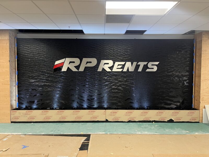 Black Scored Acrylic Water Wall with Logo for RP Rents in Naperville,, Illinois