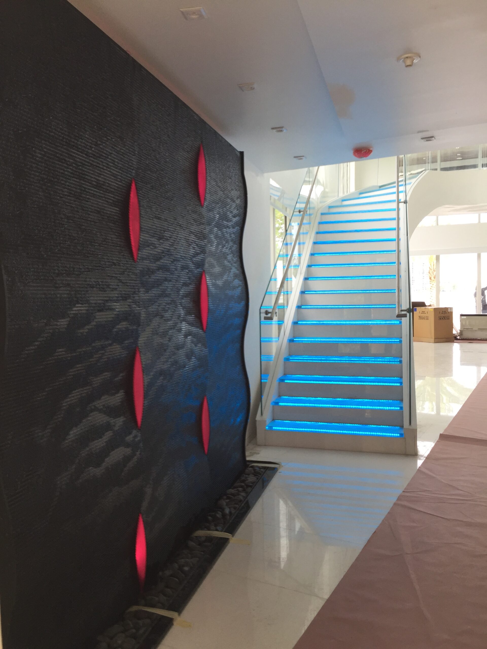 Black Scored Acrylic Weaving Wave Waterfall with LED Side Ligthts for Miami Residence 3 scaled