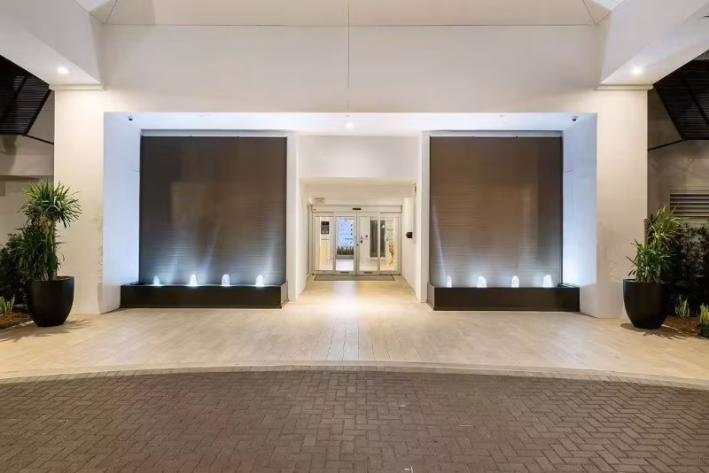 Brown Copper Painted Scored Acrylic Aquafalls with Reflection Pool Basin and Bubbler Jets at Beachcomber Resort & Club in Pompano Beach, Florida