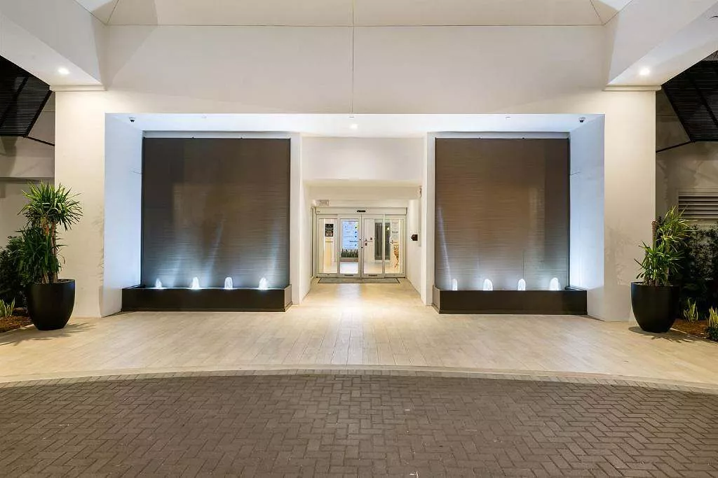 Brown Copper Painted Scored Acrylic Aquafalls with Reflection Pool Basin and Bubbler Jets at Beachcomber Resort & Club in Pompano Beach, Florida