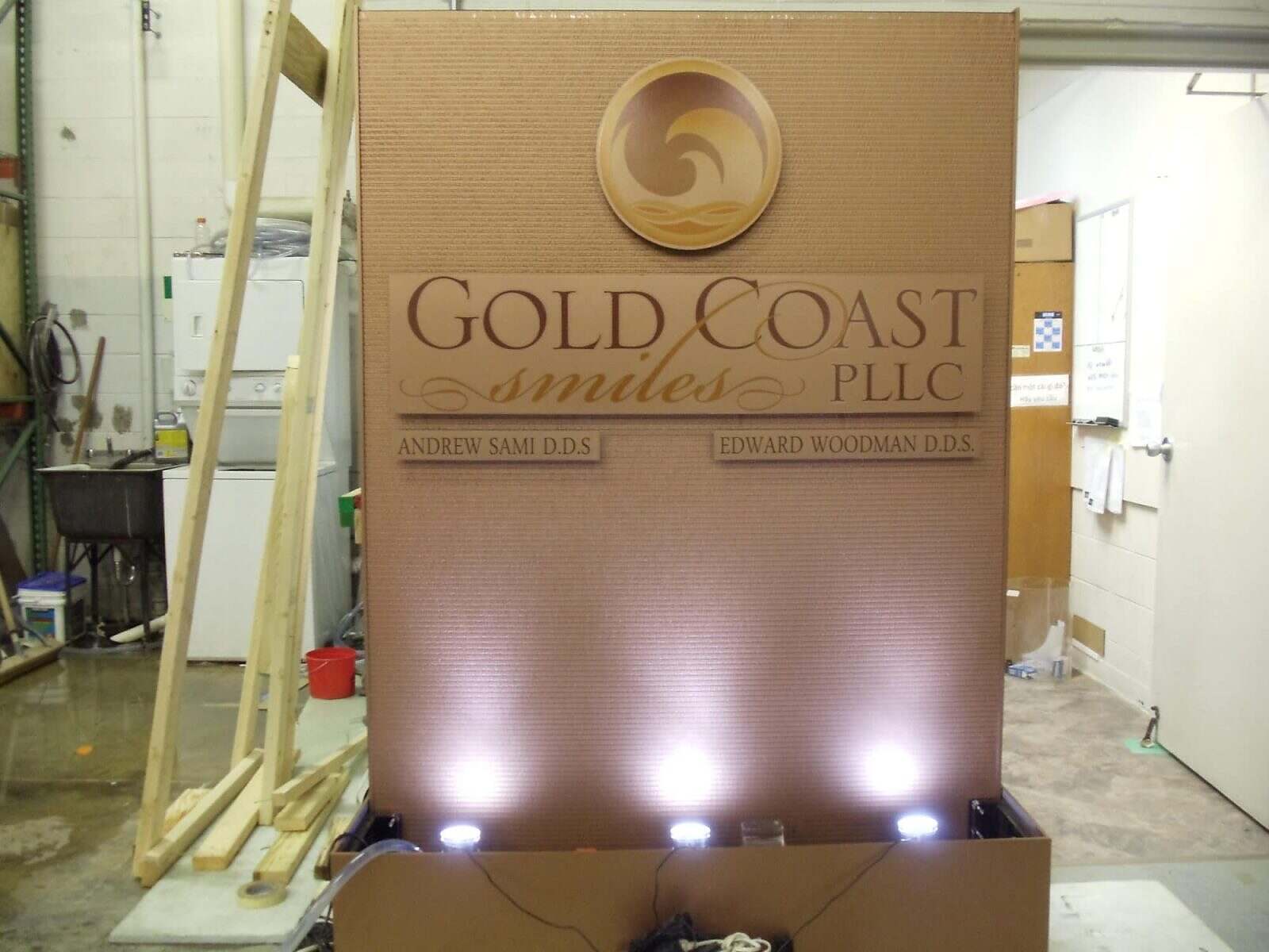 Copper waterfall fountain installation by Midwest Tropical, showcasing a sleek design with ambient lighting, emphasizing custom water features for various spaces.