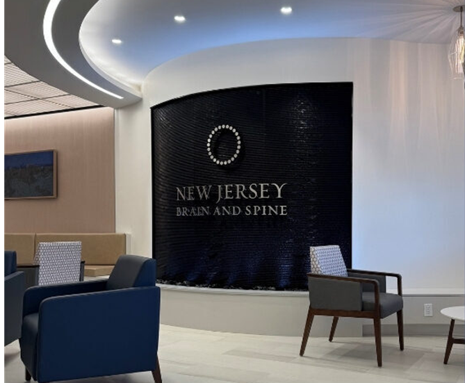 Curved Black Scored Acrylic Aquafall Water Wall with Logo for New Jersey Brain and Spine in Paramus NJ 1