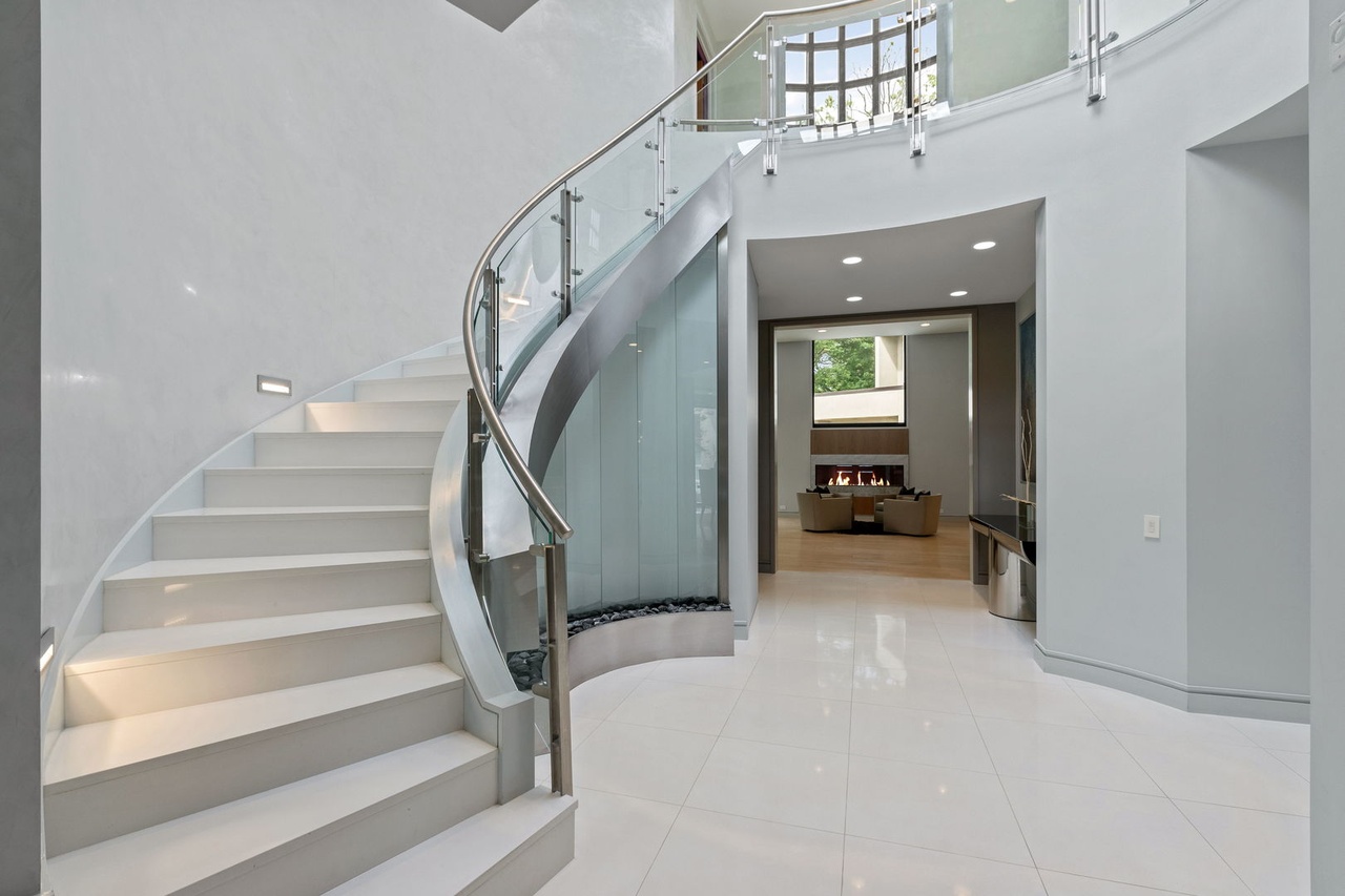 Curved Glass Water Wall with Stainless Steel Frame for Home in Glencoe, Illinois