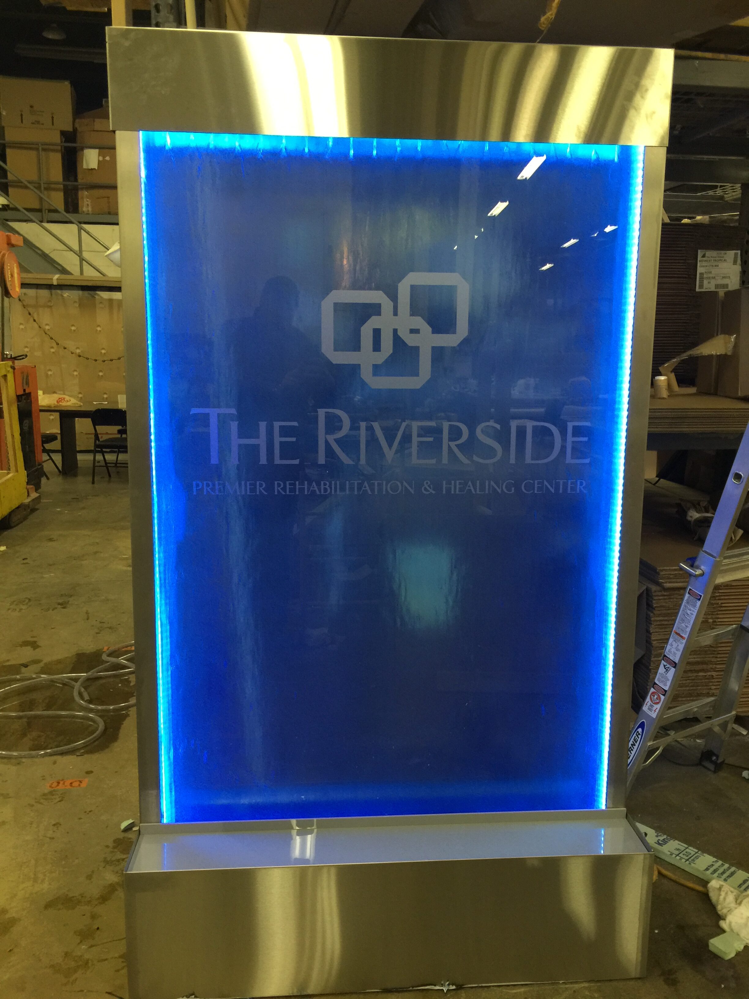 Enclosed Sealed Blue Glass Acrylic Water Wall with Logo rotated