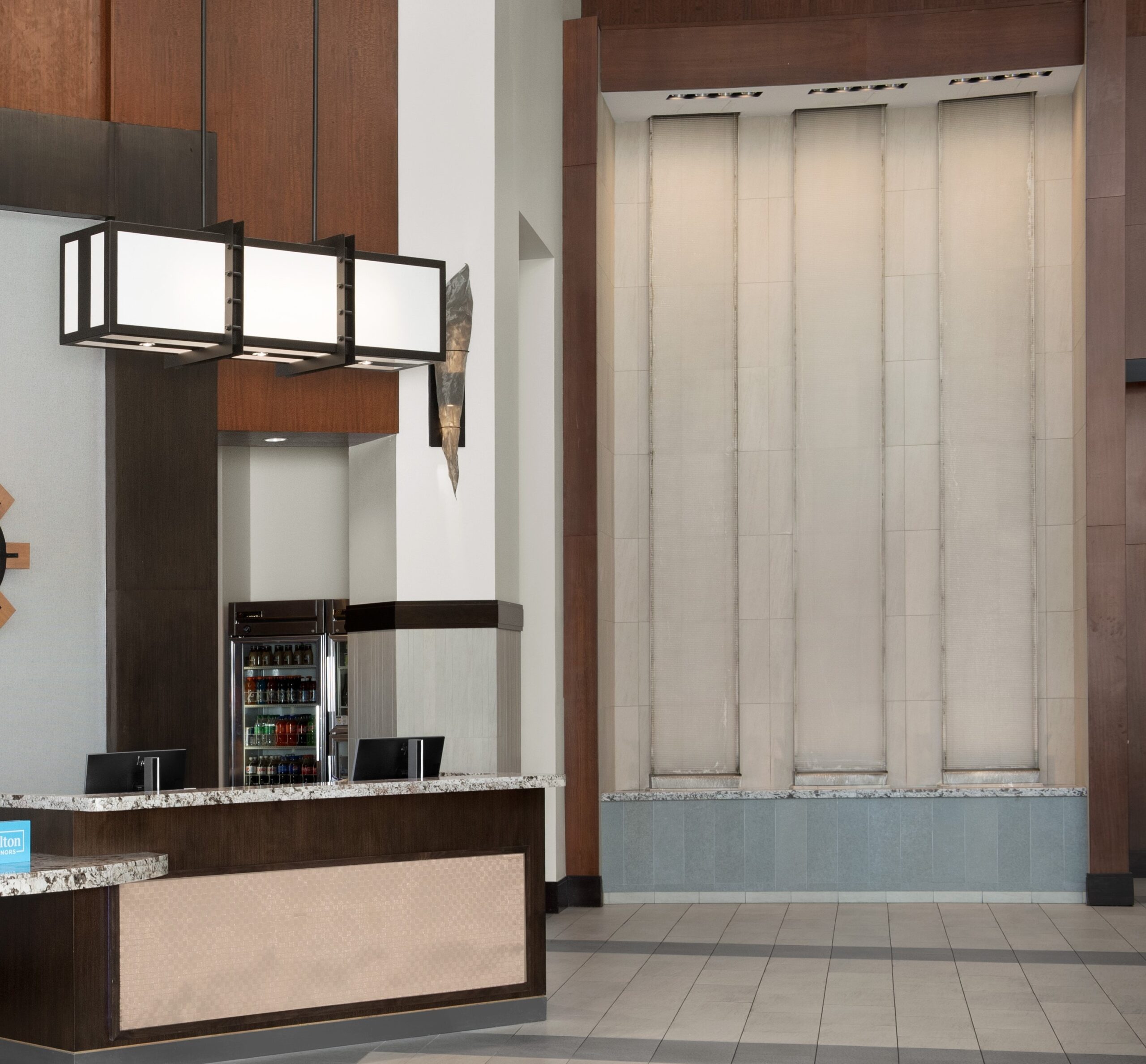 Frameless Glass Acrylic Water Wall with Weirs into Reflection Pool at Embassy Suites Springfield Virginia scaled