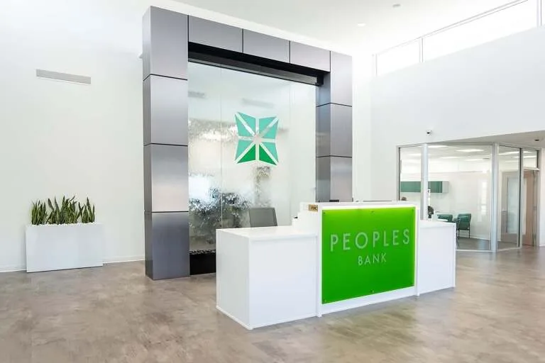 Frameless Glass Water Wall for Peoples Bank in Eva Midwest Tropical