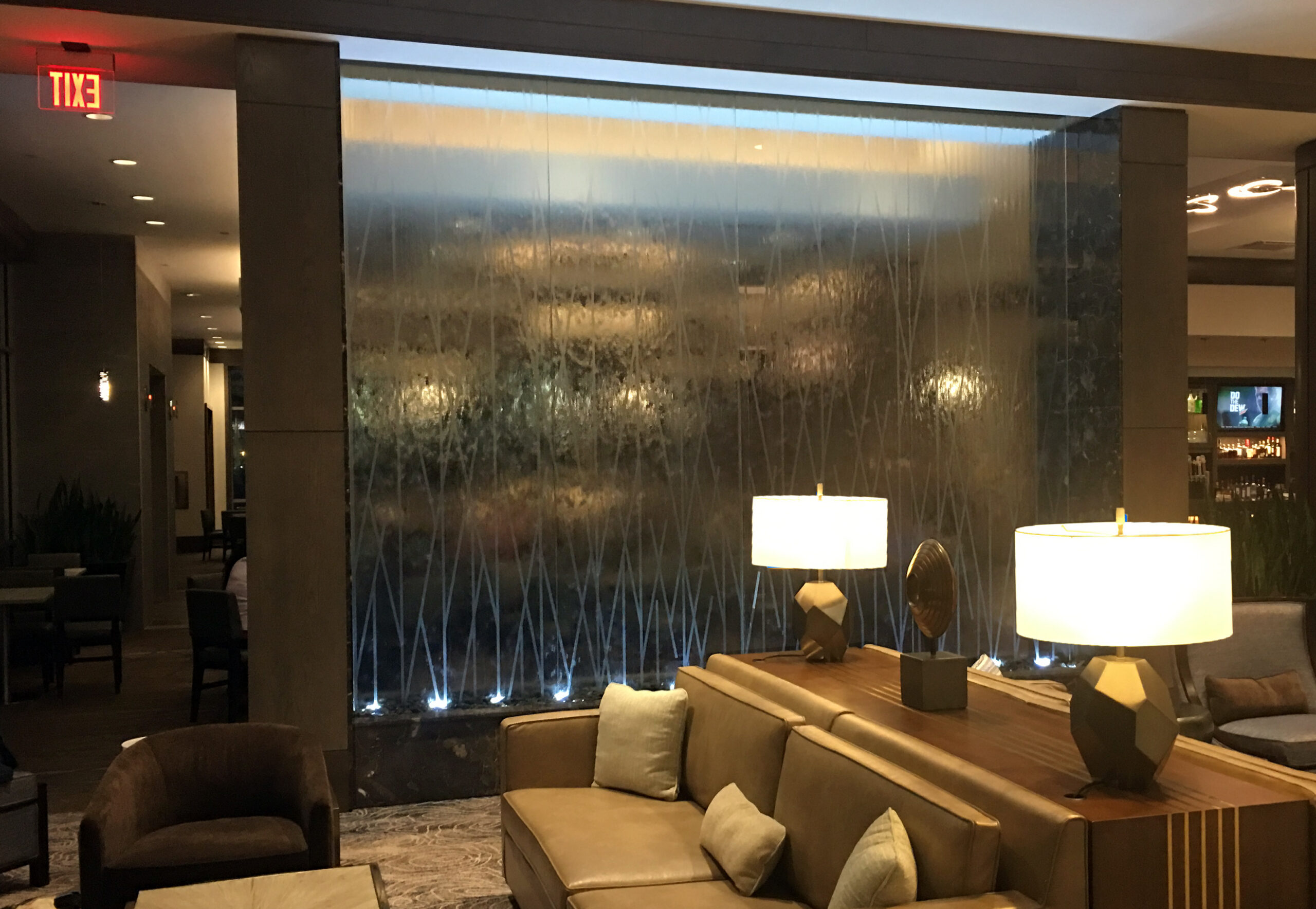 Glass Water Wall with Etching Logo Design at Embassy Suites Katy Texas scaled