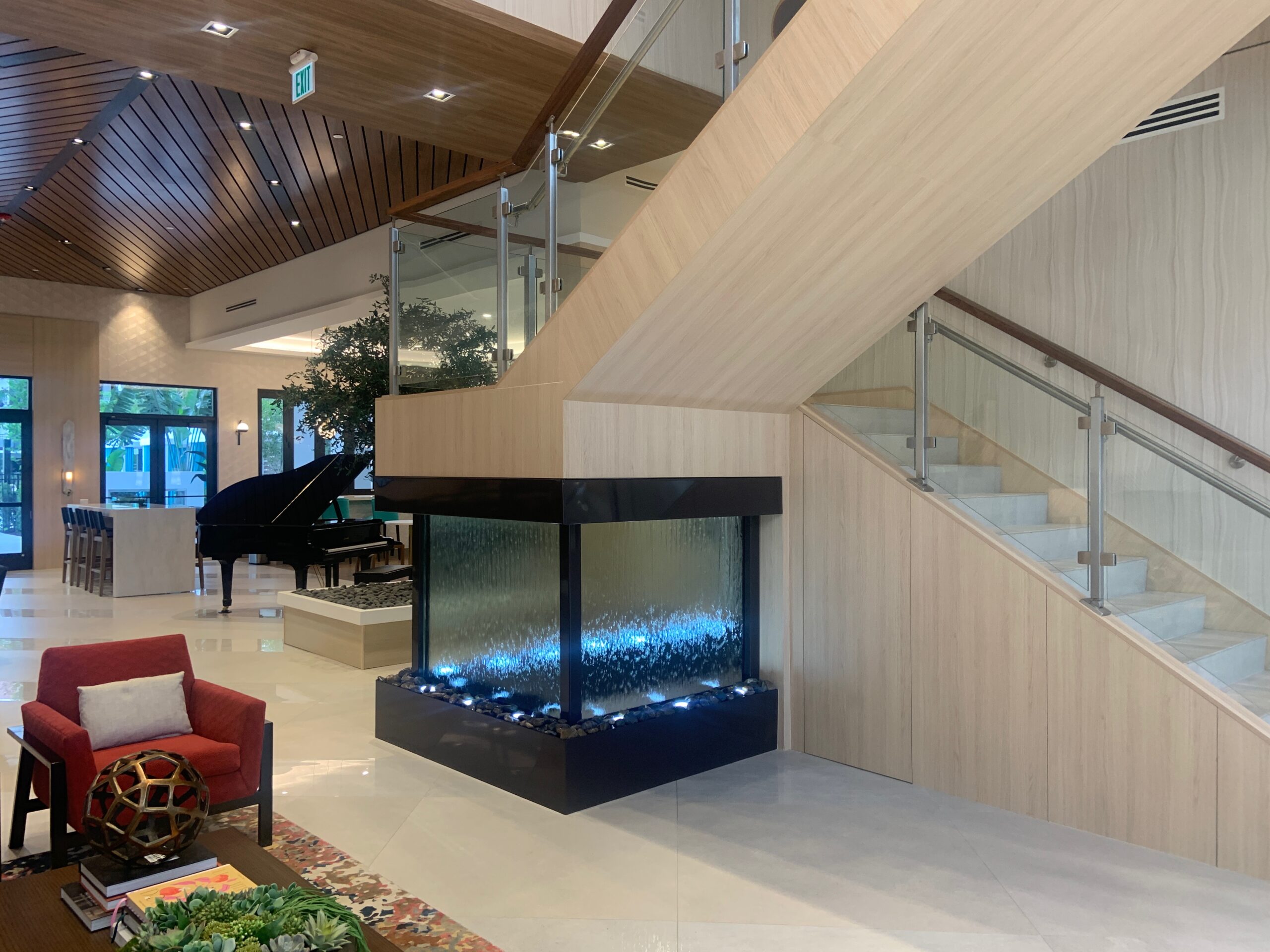 Glass Water Wall with Powdercoated Brown Painted Finish under Stars at The Residences at Monterra Commons in Cooper City (miami), Florida