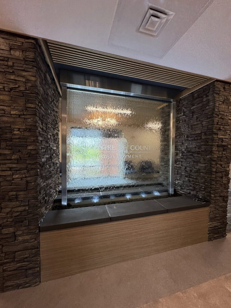 Glass Water Wall with Stainless Steel Frame with etched vinyl logo for Centre County Community Services Building in Bellefonte, PA 5 Glass Water Wall with Stainless Steel Frame with etched vinyl logo for Centre County Community Services Building in Bellefonte, PA 5
