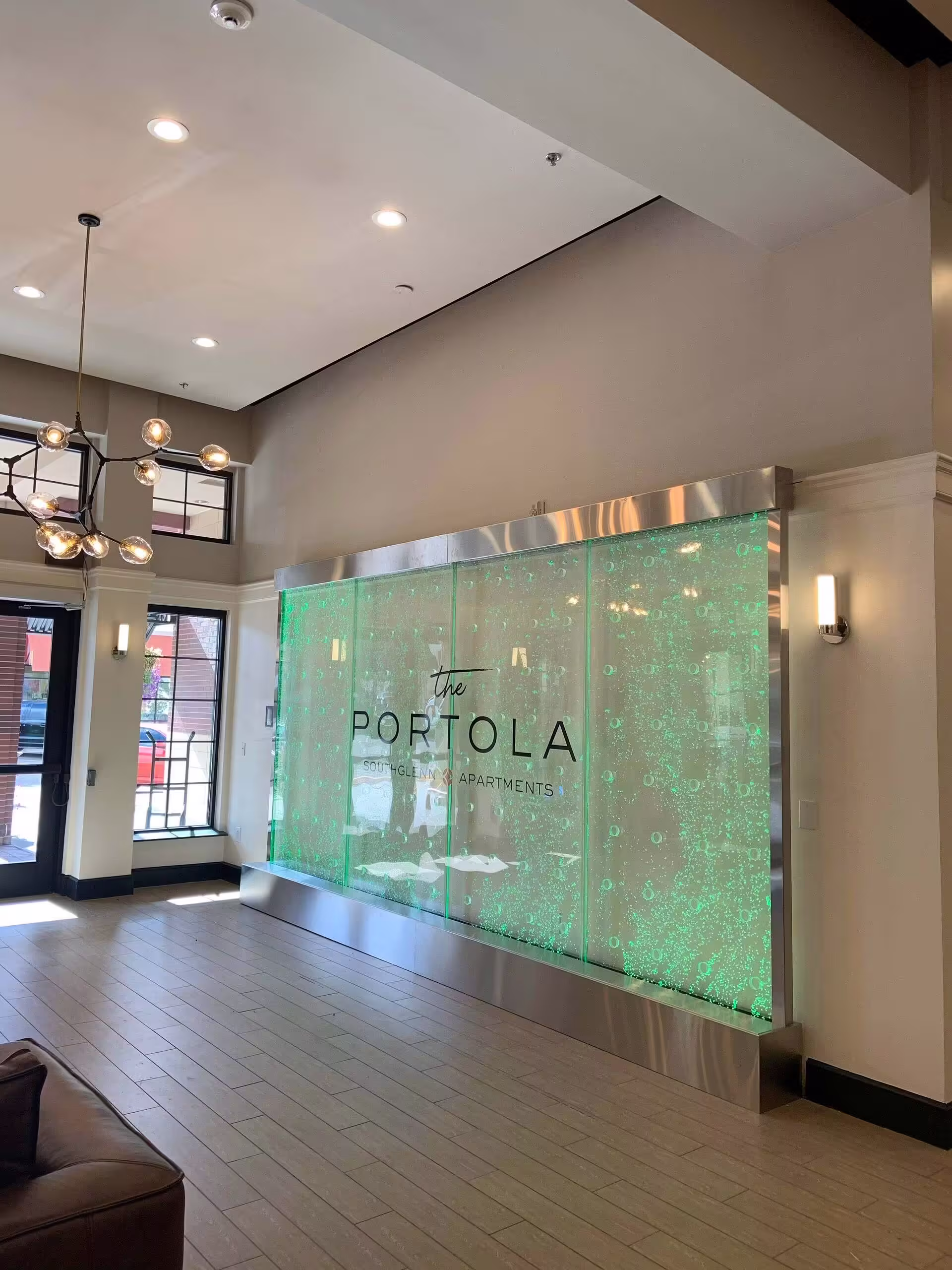 Rod Style Swirley Bubble Wall with Stainless Steel Frame at Portola Apartments Denver, Colorado