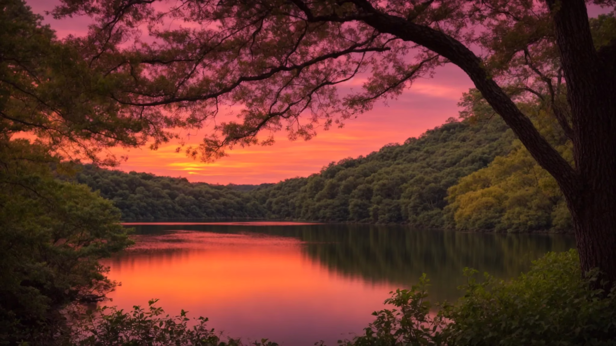Create Stunning Custom Outdoor Spaces for Your Home 6 a vibrant sunset paints the sky in hues of orange and pink, casting a warm glow over a tranquil lake surrounded by lush greenery, creating a serene atmosphere of peaceful solitude.