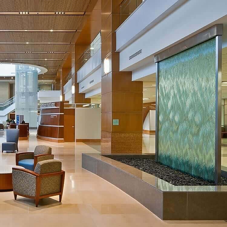 textured glass water wall university of kentucky patient care facility interior fountain