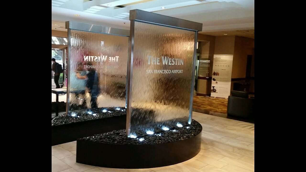 Video Custom Glass Waterfall Walls at Westin Hotel at San Francicso Airport-Water Walls with Etched Logo